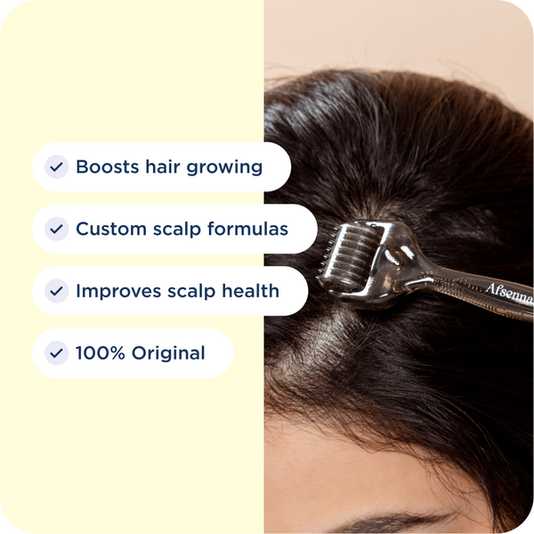 Hand holding the Afsennah Microneedle Scalp Roller with its key benefits listed